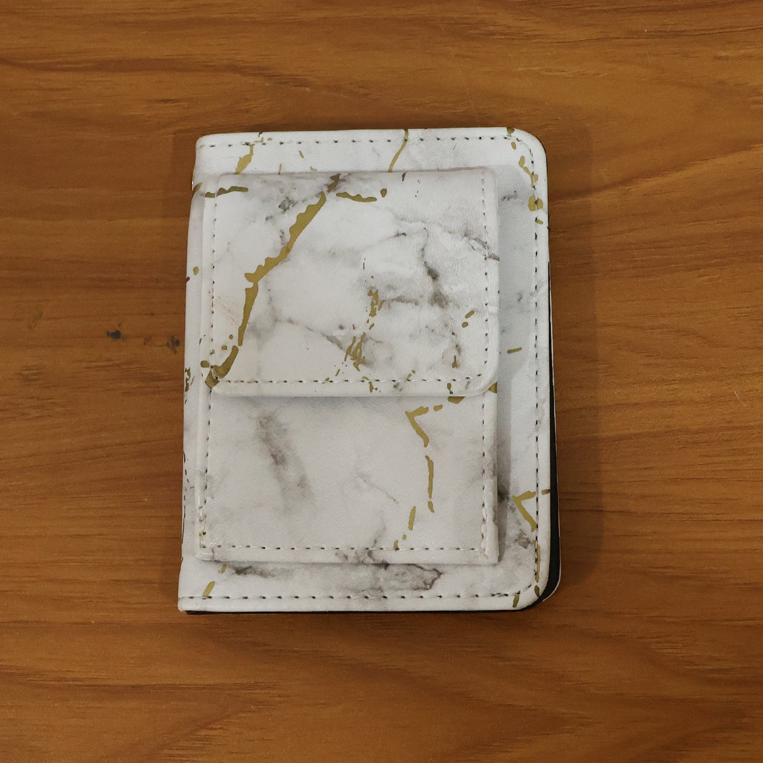 Wukusy compact marble finish snap button card holder wallet with sleek design and multiple card slots.