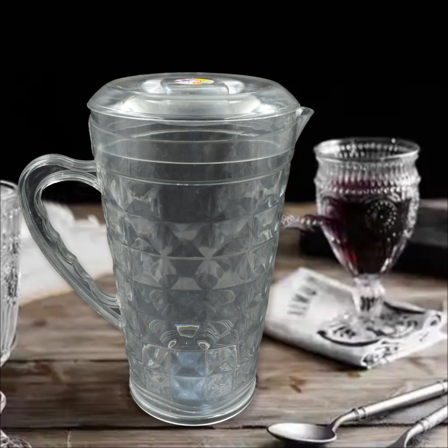 Wukusy 3692 Mocktail Pet Plastic Jug with lid, transparent reusable water jug ideal for home and restaurant beverage serving.