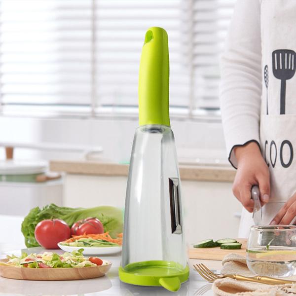 Wukusy 2404 smart multifunctional vegetable and fruit peeler, kitchen tool with ergonomic handle and stainless steel blade.