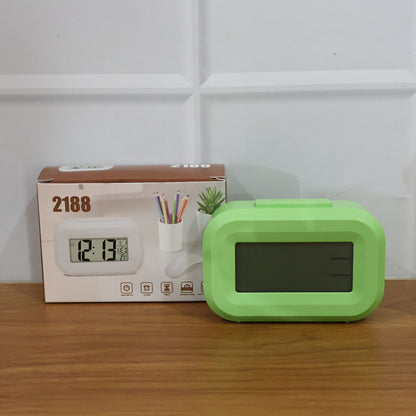 Digital alarm clock with clear LED display from Wukusy showing time and alarm settings on a sleek black device.