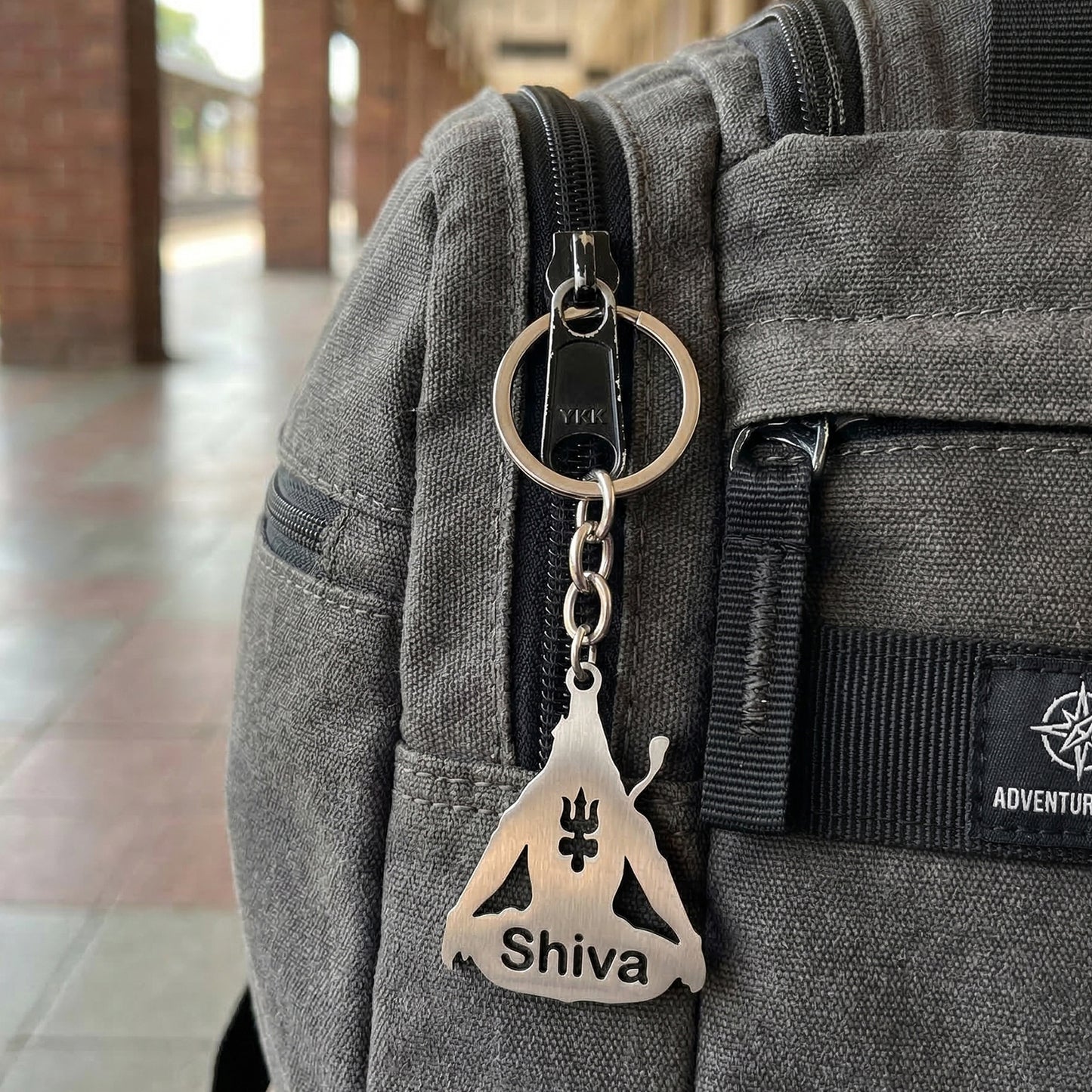 Wukusy premium metal Lord Shiva Trishul design keychain with intricate detailing, featuring a symbolic religious motif.