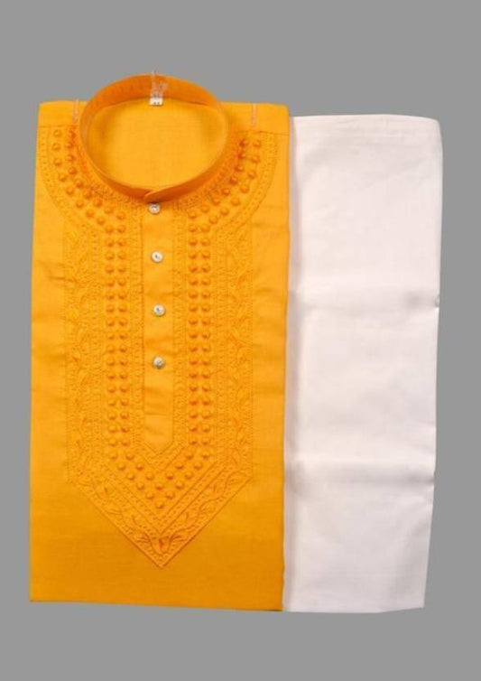 Men's yellow and white cotton embroidered kurta with matching pyjama in a traditional men's kurta set.
