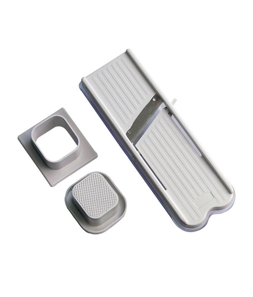 Wukusy stainless steel vegetable and dry fruit slicer and cutter showing sharp blades and sliced produce.
