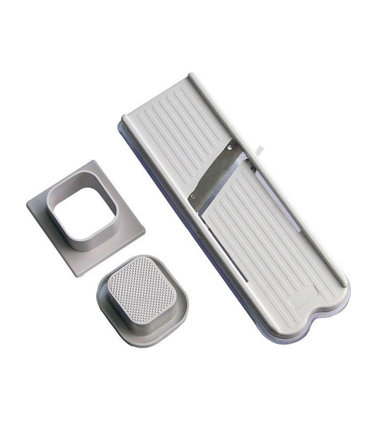 Wukusy stainless steel vegetable and dry fruit slicer and cutter showing sharp blades and sliced produce.