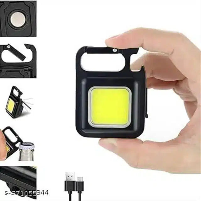 Black plastic keychain rechargeable LED flashlight, compact and portable with bright illumination for quick use.