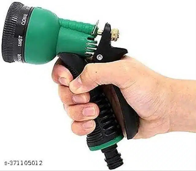 Green and black plastic garden faucet from 11853, showing a close-up of the outdoor water spigot with handle and threading.