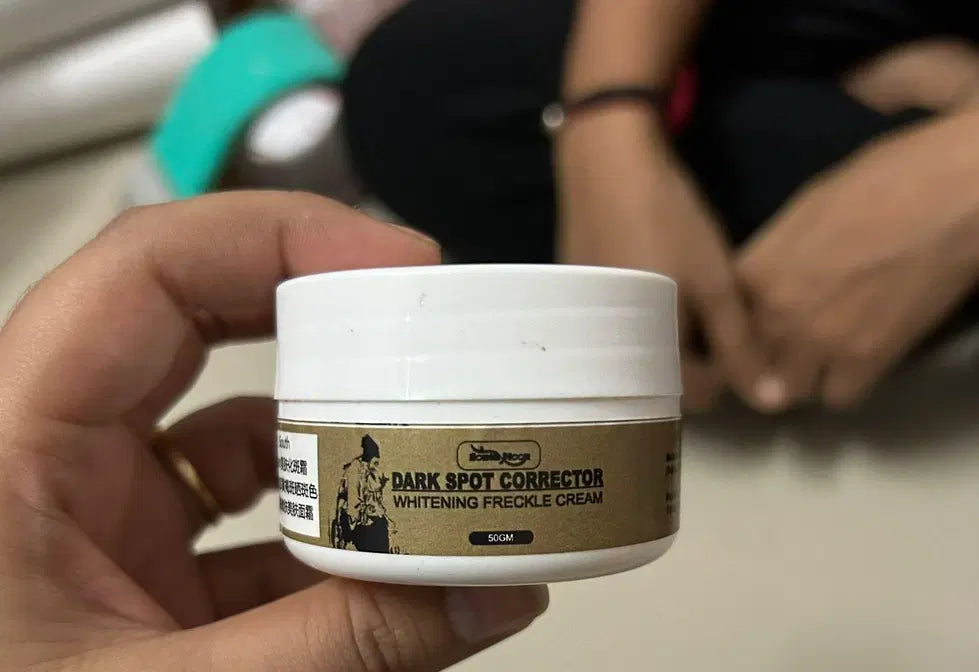 Two 50g jars of 1238 Dark Spot Corrector Whitening Frackle Cream, displaying the cream's smooth texture in a clear container.