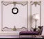 Analog wall clock with a sleek design, premium quality, featuring a round face and clear black hour and minute hands.