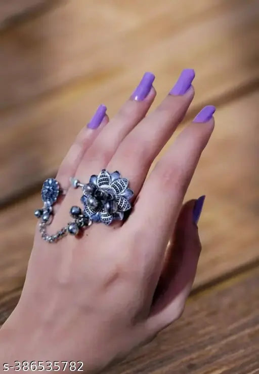 Elegant women's jewelry set featuring a creation beautiful ring with intricate design and sparkling details.
