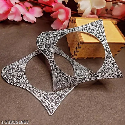 Silver-toned oxidised bangles with ethnic square-shaped pattern, part of women's jewellery set featuring traditional Kada design.