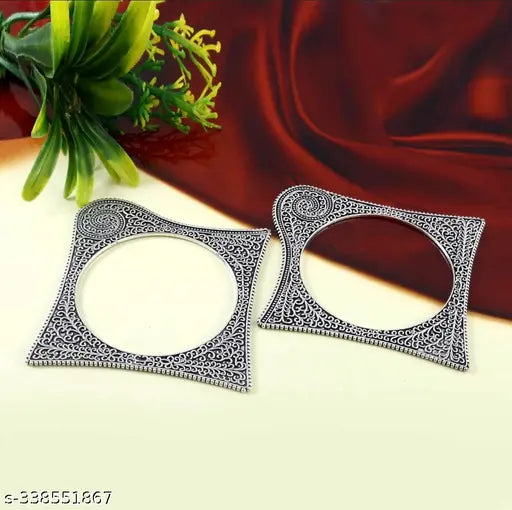 Silver-toned oxidised bangles with square-shaped ethnic kada pattern, part of a women's jewellery set.
