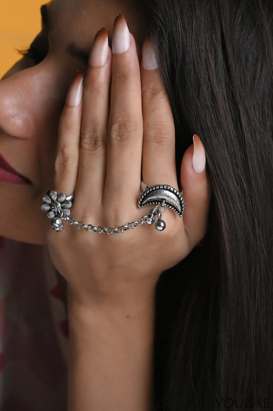 Women's jewelry set featuring two elegant rings with intricate designs, showcasing the 13069 brand.
