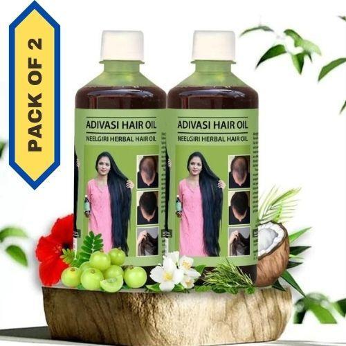 Adivasi Hair Oil pack of 2 bottles, 100 ml each, featuring natural hair oil in transparent bottles with labels.