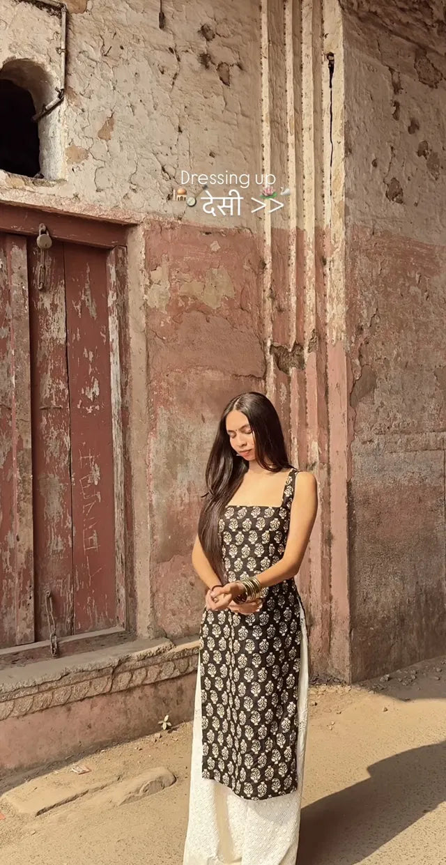 Black printed sleeveless women's kurta with straight fit, stylish design, perfect for casual or festive wear.