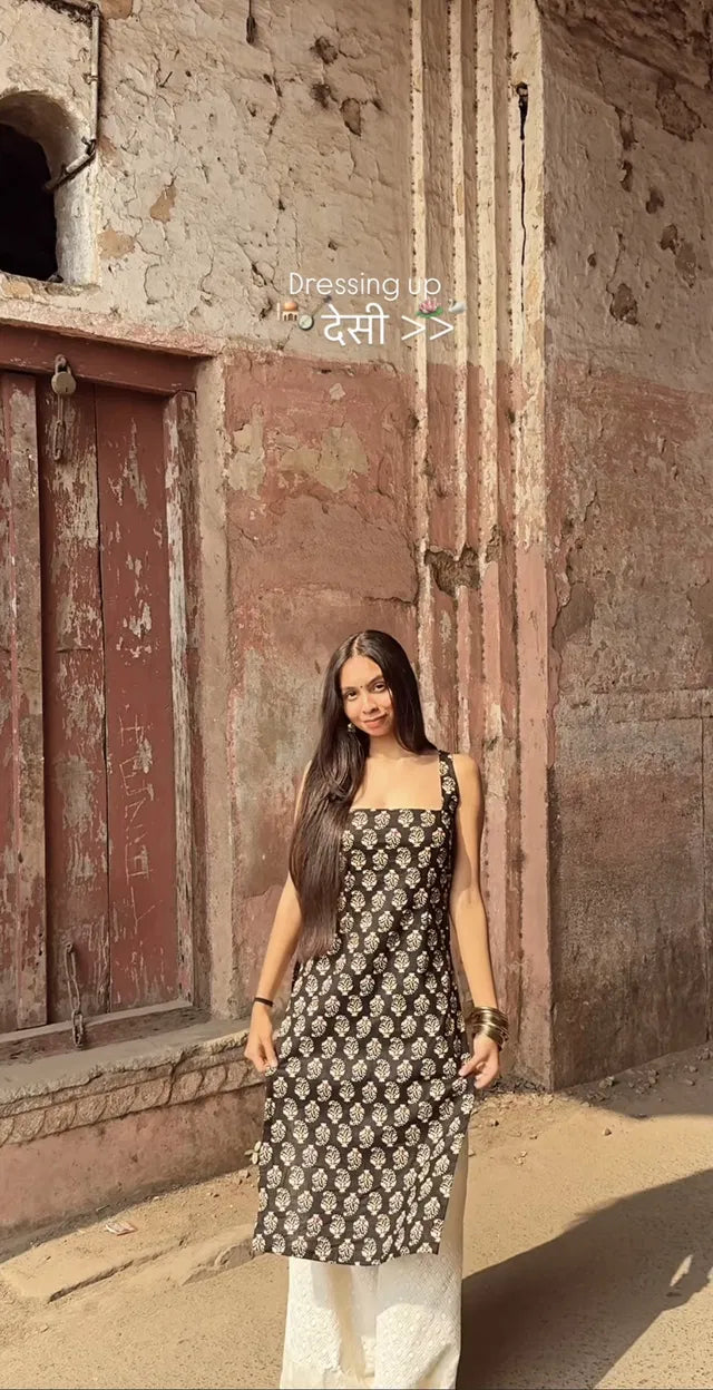 Black women's printed straight sleeveless kurta from 13374, featuring a stylish and comfortable kurtis design.
