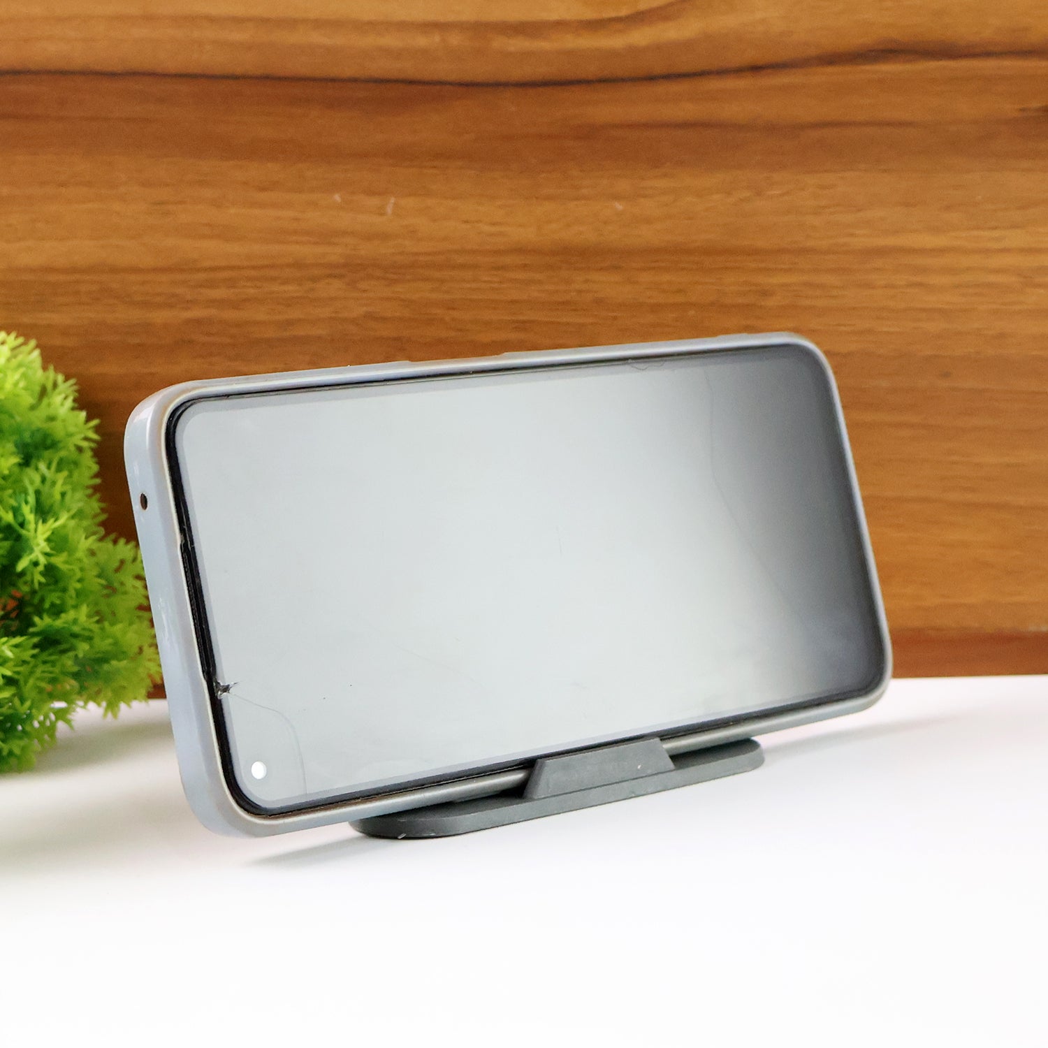 Wukusy Pyramid Grey mobile stand with three inclined angles, designed for adjustable smartphone positioning.