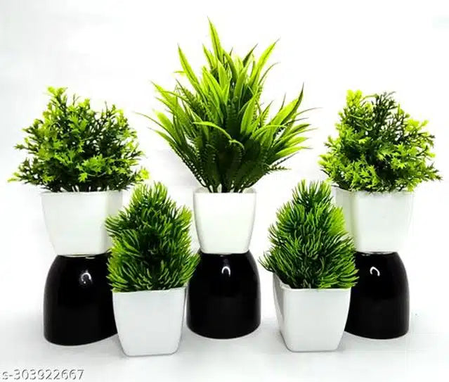 Set of 5 artificial green and white plants with pots, featuring realistic flowers and shrubs for home decor.
