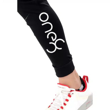 Black polyester men's track pants by 13455, size 28, featuring comfortable athletic design and tapered fit.