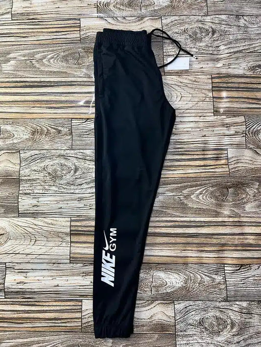 Men's black track pants by 13455, size 28, featuring a comfortable fit and athletic style, shown in the product image.
