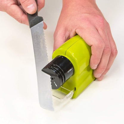 Wukusy 135 cordless motorized knife blade sharpener tool for kitchen use, showing the compact device with sharpening components.
