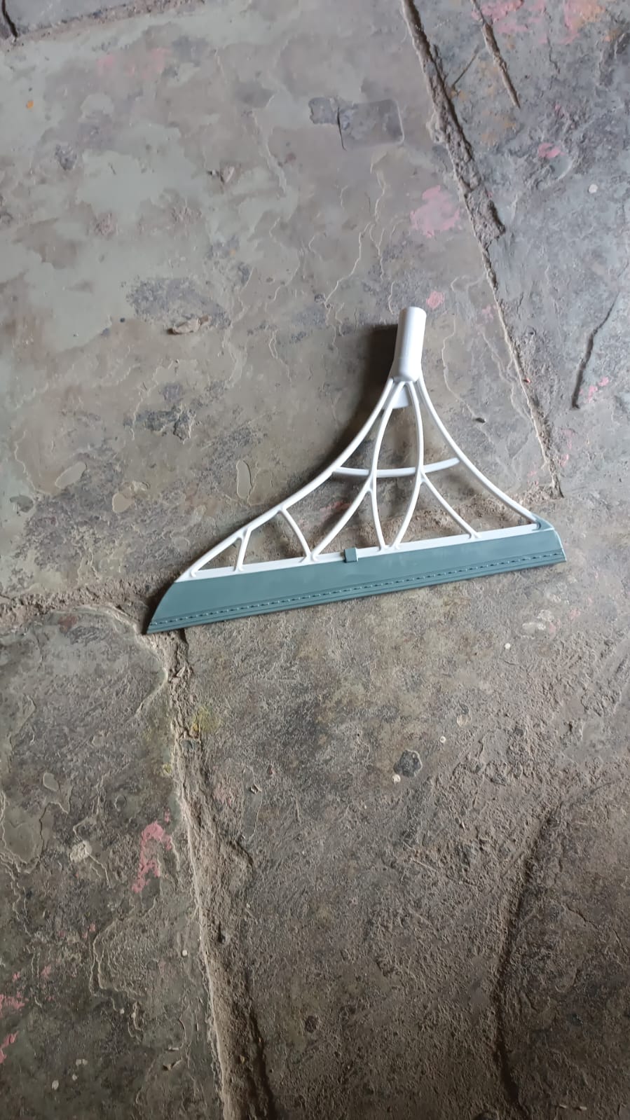 Set of four Wukusy dustpan and squeegee kitchen cleaning tools with broom brushes for window and surface cleaning.