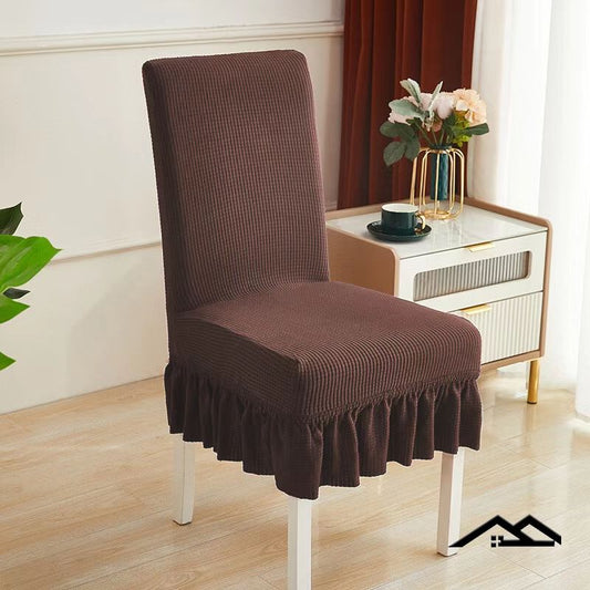 Set of four brown thick skirt sofa chair covers by 15631, showing durable fabric and tailored fit for furniture protection.