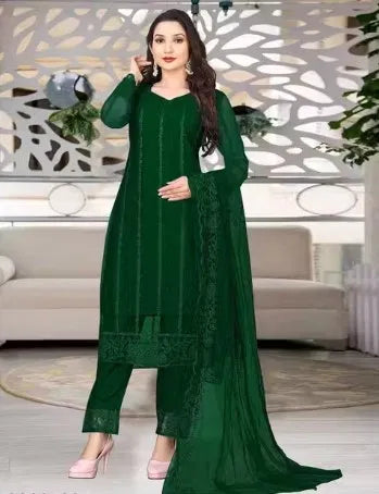 Green women's kurta set with dupatta and bottomwear, featuring traditional embroidery and comfortable fit.