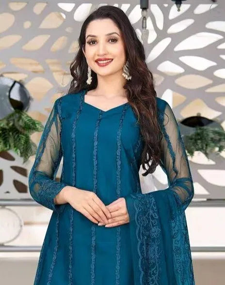 Teal women's kurta set with dupatta and bottomwear, featuring traditional embroidery and comfortable fabric from 15801.