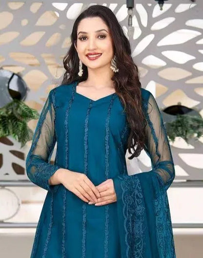 Teal women's kurta set with dupatta and bottomwear, featuring traditional embroidery and comfortable fabric from 15801.