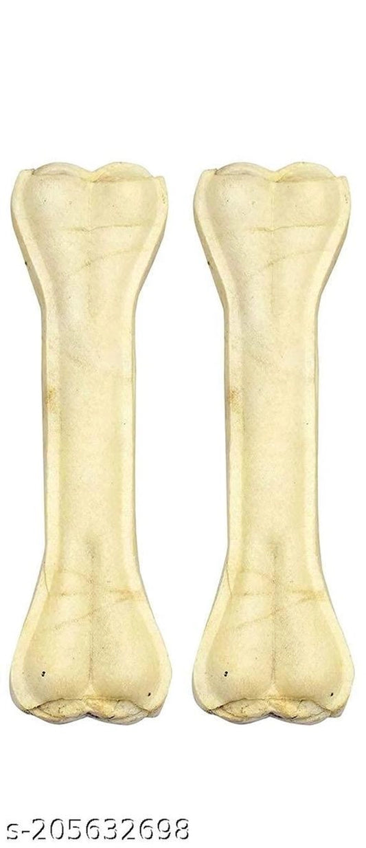 Pair of 7-inch rawhide bone treats for dogs, displayed on a pet bed, from brand 15929, in a pack of two.