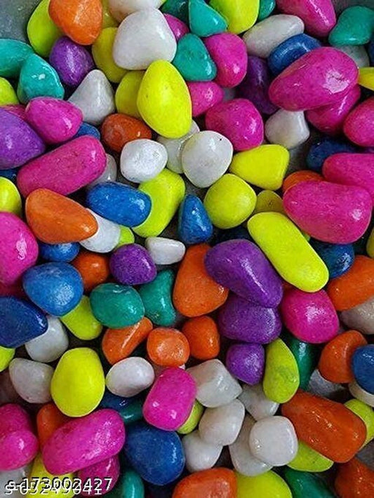 Colorful decoration pebbles stones for pet beds, multicolor, 2000 g, shown scattered on a soft pet bed surface.