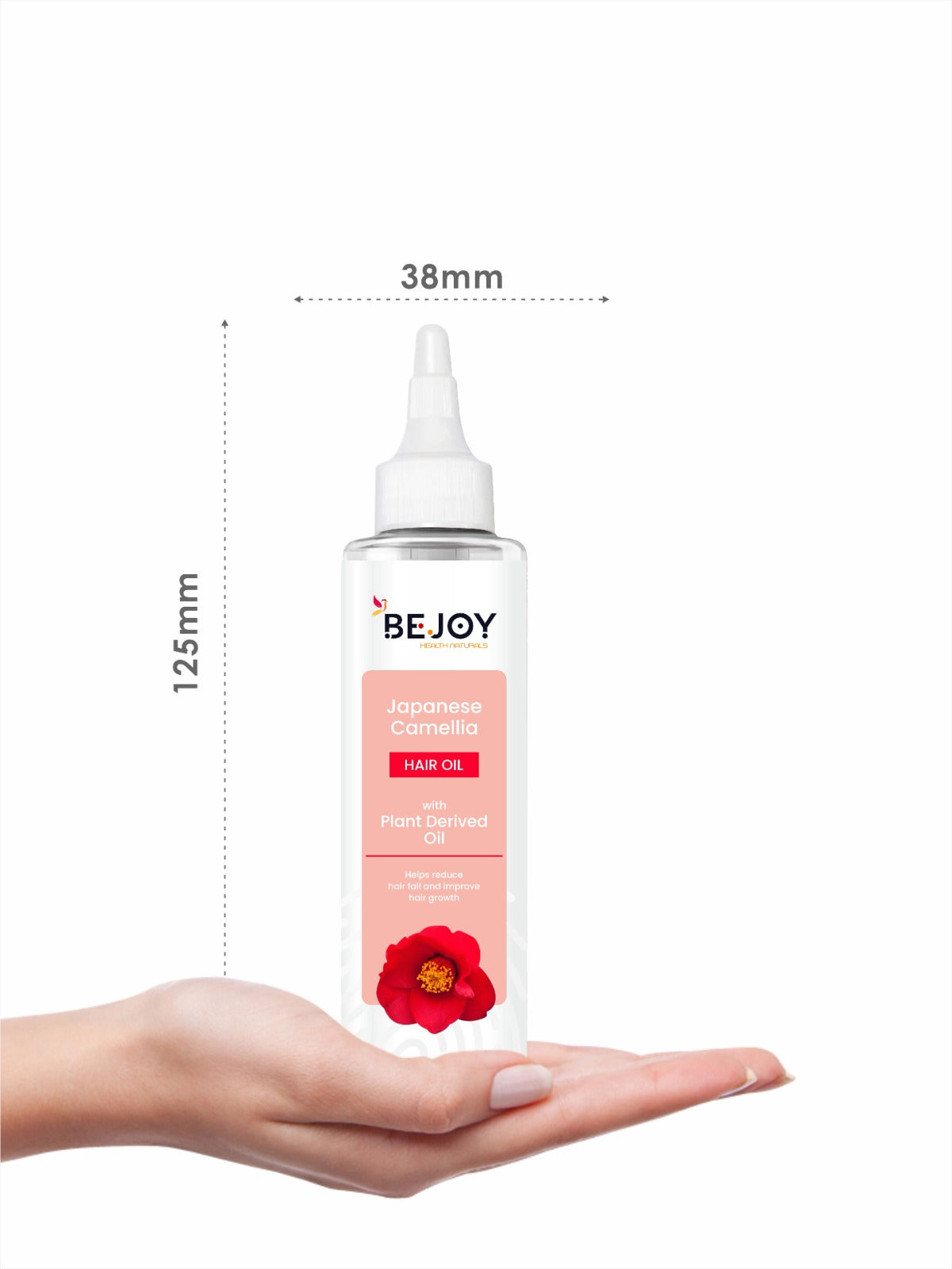 Bejoy Japanese Camellia Hair Oil applied to hair, with a hair curler in the background, showcasing styling and hair care.