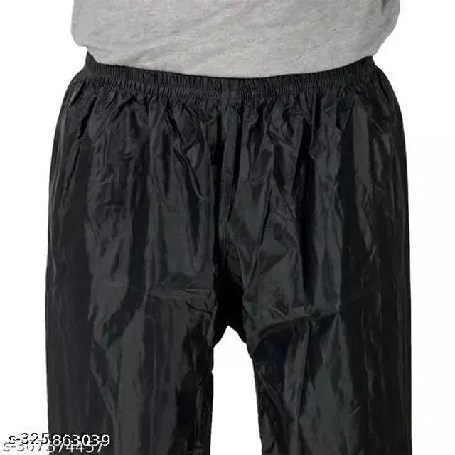 Black polyester rain coat for men by 16824, free size, waterproof and lightweight, shown on a plain background.