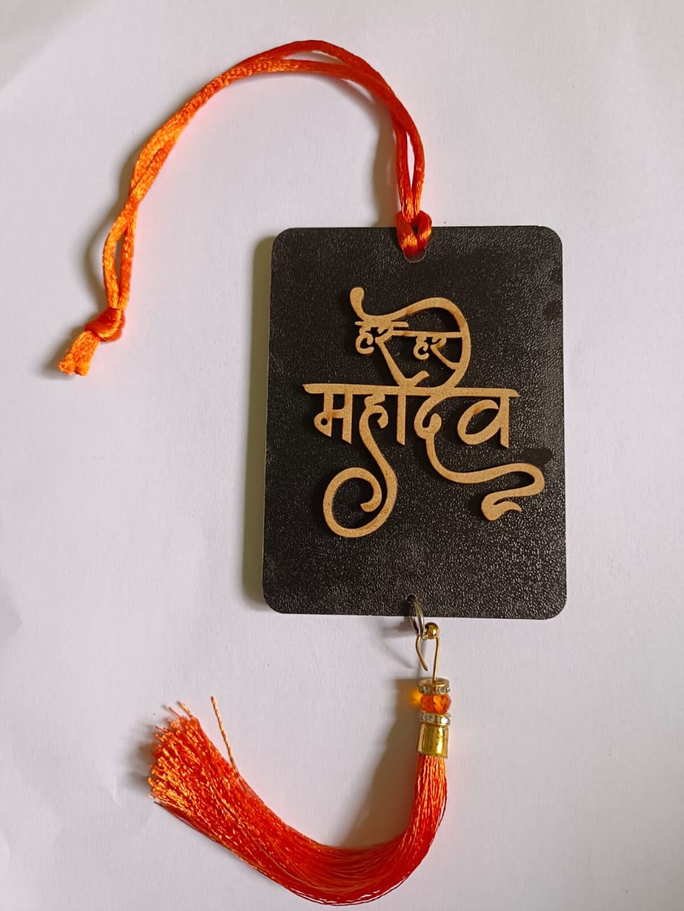 Multicolor handmade Har-Har Mahadev car hanging ornament for positivity, featuring traditional wall decor and hanging craft.