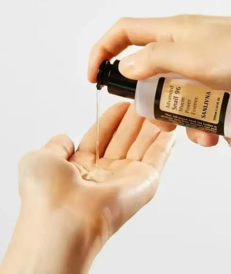 Two bottles of 1690 Snail 96 Mucin Power Essence, 100 ml each, in a skin treatment pack, featuring clear packaging and product labels.