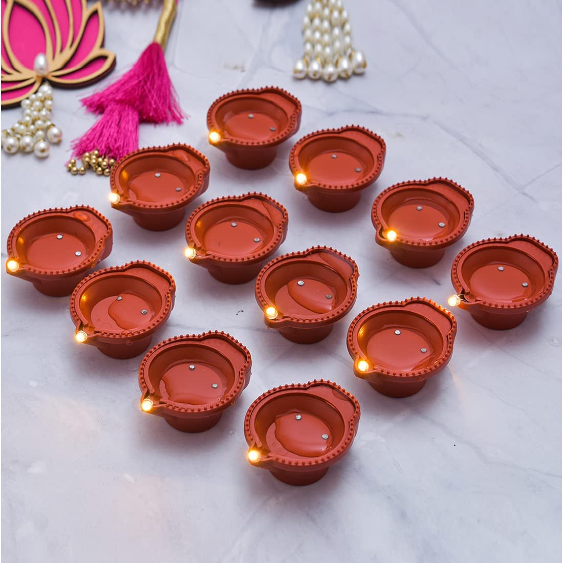 Set of 6 water sensor Diya floating LED lights for home decor and Diwali festivals, featuring traditional diya design with glowing illumination.