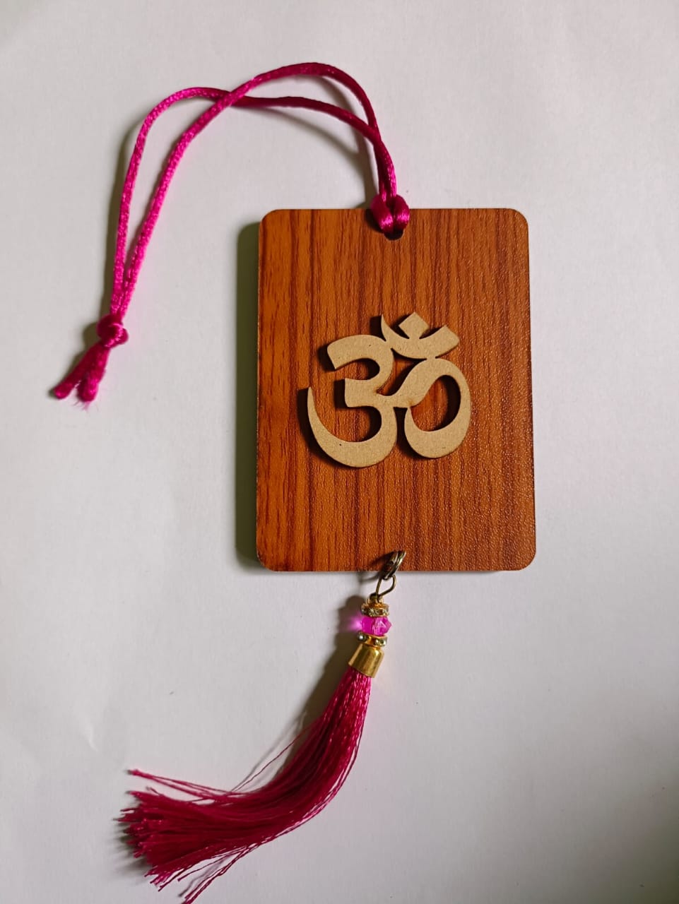 Multicolor handmade Ak Ultimate Om car hanging ornament with positive symbols, designed as a decorative wall hanging.