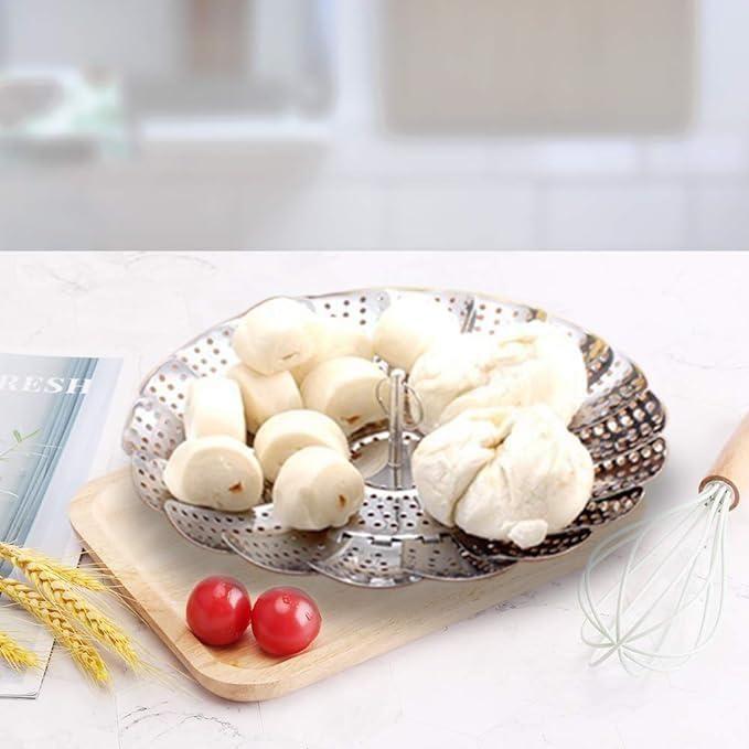 Stainless steel steamer basket for vegetables and seafood with safety tool, ideal for steaming in kitchen cookware.
