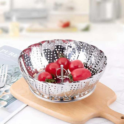 Stainless steel steamer basket for vegetables and seafood with safety tool, ideal for steaming and idli making in the kitchen.