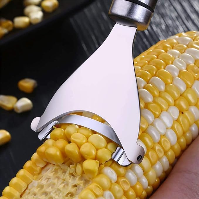Stainless steel corn peeler with ergonomic handle and ultra-sharp blades for effortless kernel removal, in silver.