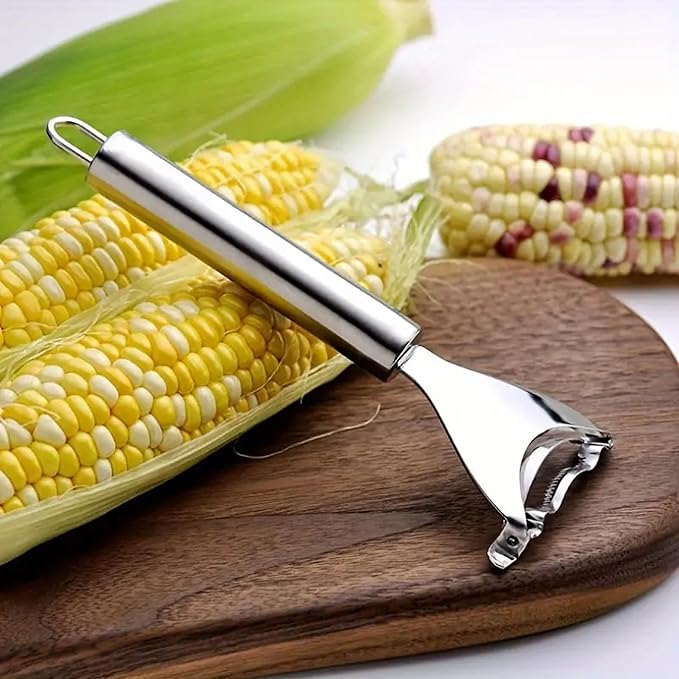 Stainless steel corn peeler with ergonomic handle and ultra-sharp blades for easy kernel removal, silver color.