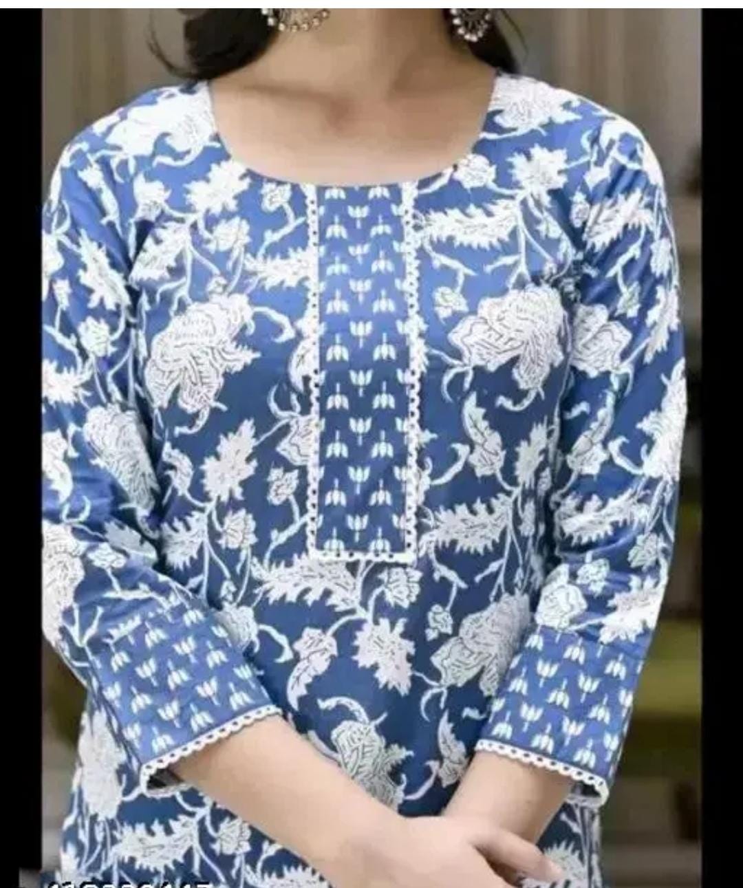 Women's floral round neck kurta set by 19199, featuring a traditional design with vibrant flower patterns and matching bottoms.