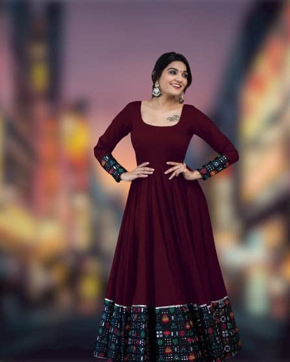 Women's rayon solid pattern full sleeve stitched gown with a full-length design and stylish detailing.