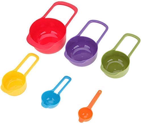 Set of six colorful plastic measuring cups and spoons for baking and cooking, kitchen tool set in rainbow colors.