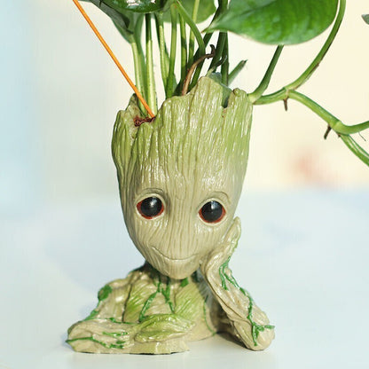 Basil seeds for good luck money plant in a Groot-themed vase, featuring vibrant green basil sprouts inside clear glass.