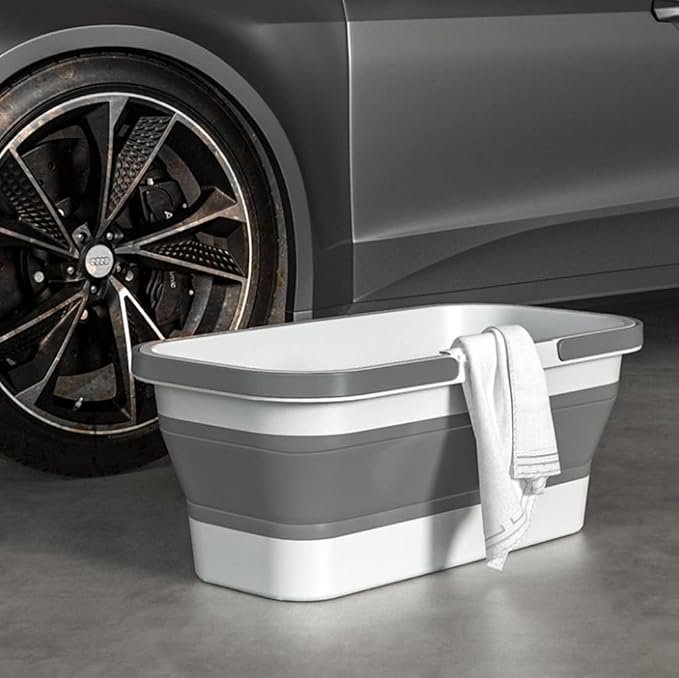 Lightweight collapsible plastic bucket with wheels, ideal for cleaning, camping, and RV use, featuring a rectangular design and portable handle.