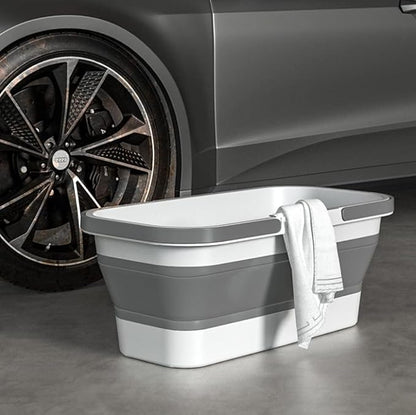 Lightweight collapsible plastic bucket with wheels, ideal for cleaning, camping, and RV use, featuring a rectangular design and portable handle.