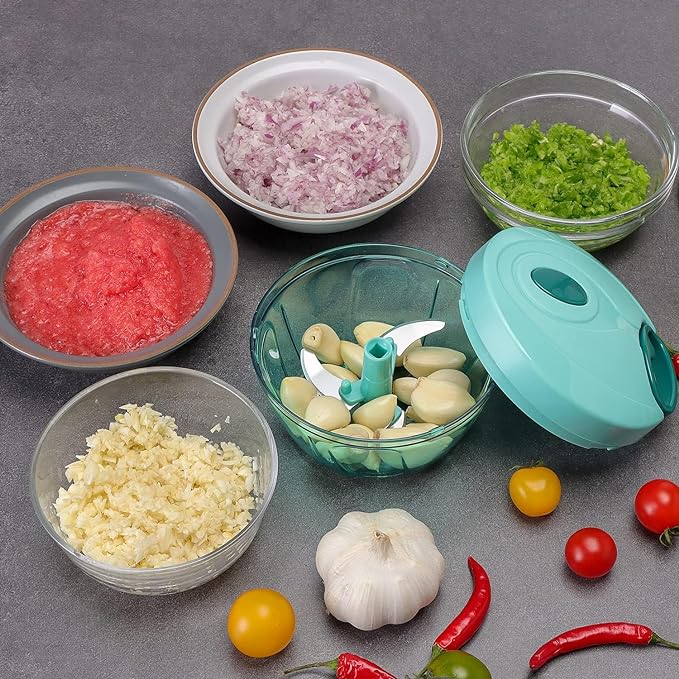 Multicolor vegetable chopper for kitchen with 3 blades, manual onion cutter and vegetable slicer, 500ml capacity.