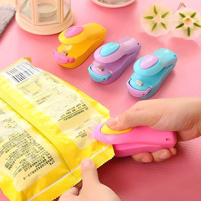 Portable mini sealing machine from 19378, battery-operated kitchen tool for sealing bags and preserving food freshness.