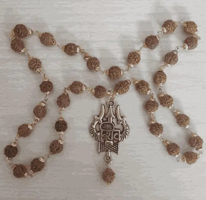 Gold plated Rudraksha chain for pooja rituals, featuring intricate design and traditional craftsmanship.